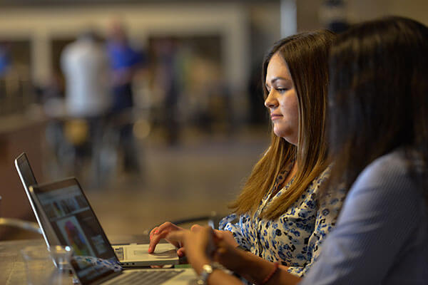 MBA students working on a business presentation.