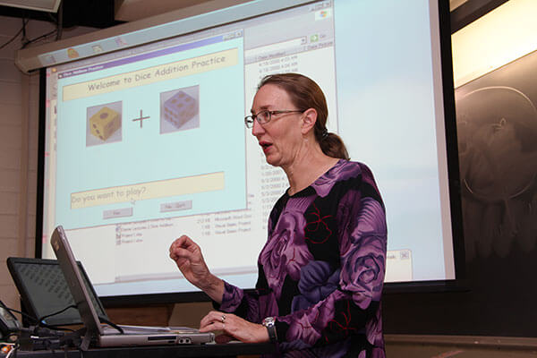 Carol Redfield, Ph.D., instructs a Computer Science class.