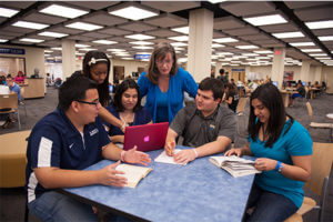 Kathleen Maloney in the library with students