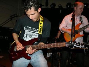 Jason Torres playing his guitar