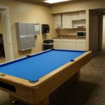 Lounge at Lourdes Hall featuring a pool table, vending machine, mini kitchen and study area