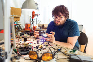 Matteo Borri working at a workbench full of electrical tools