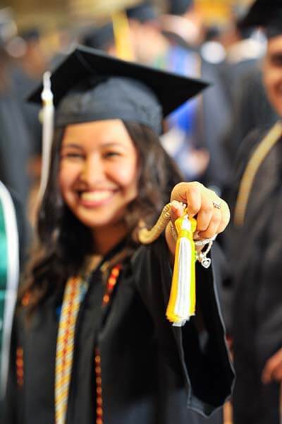 A McNair student at commencement