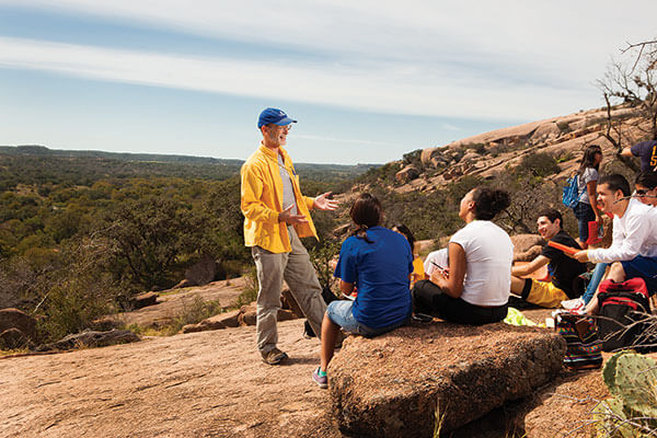 David Turner, Ph.D., talks to Environment Science students at Enchanted Rock.