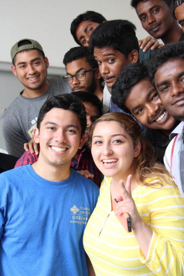 St. Mary's University undergraduates make friends with students from GMR's skills training programs.