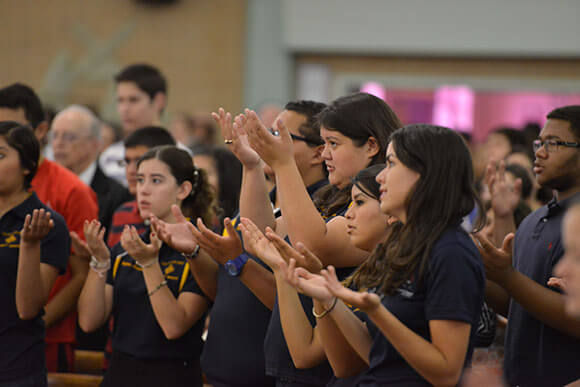 Students praying at Opening School Mass.