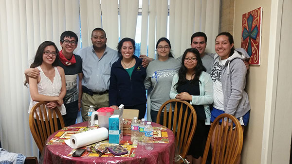 Dean Winston Erevelles with students living in Marian Hall.