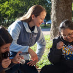 Melissa Karlin, Ph.D., instructs students during an on-campus lab in which they painted and tracked ants.