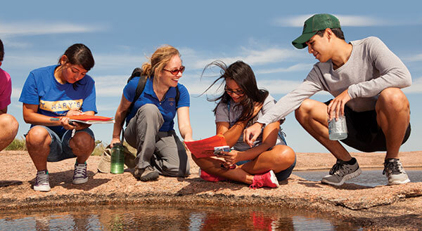 Evelynn Mitchell, Ph.D., instructs students at Enchanted Rock.