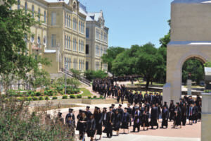 St. Mary's commencement procession winds past historic Reinbolt Hall.