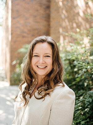 Assistant Professor of Law Zoe E. Niesel stands outside the Law Classrooms Building.