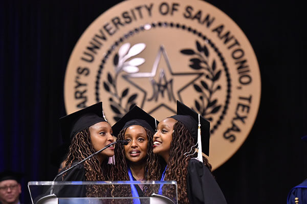 Moipei Triplets singing at Spring Commencement 2018