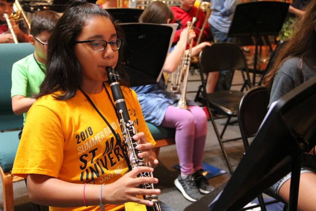 Camp student playing the clarinet