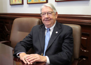 Michael Schott sits at a table