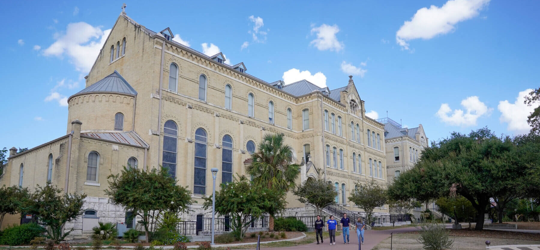 Students walk together outside Assumption Chapel