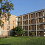 Side view of Treadaway Hall, a four-story brick building