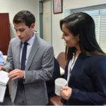 Scholar staff chat in their journal room