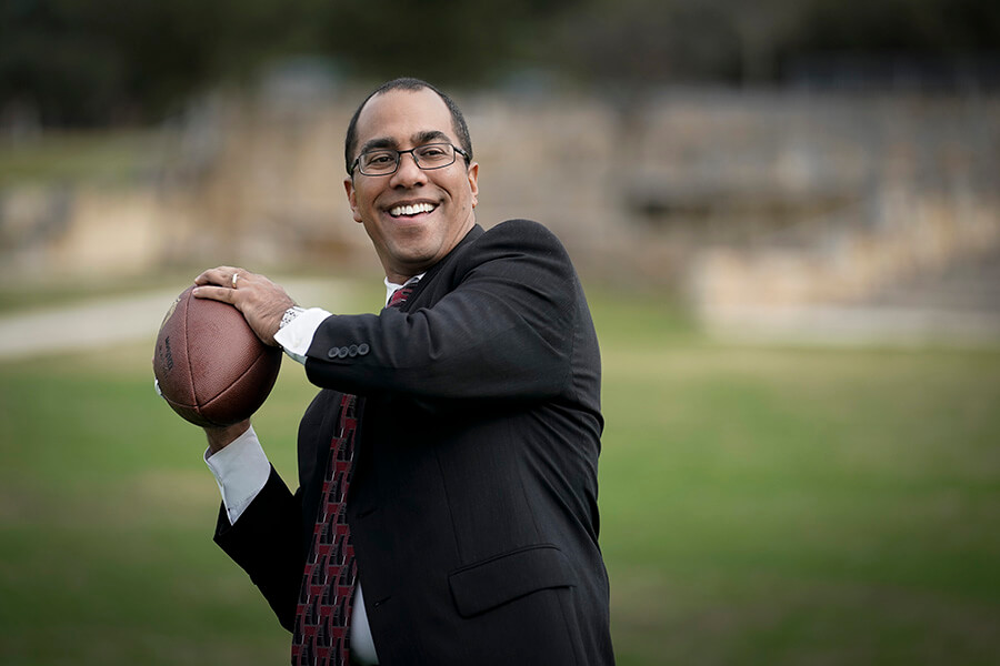 St. Mary's Law Professor David Grenardo plays with a football.