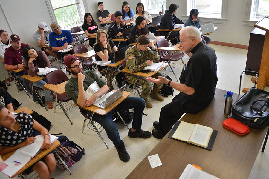 A teacher leads a theology class.