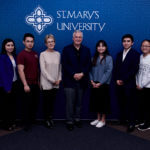 Carlos Alvarez joins students at a scholarship luncheon on March 5, 2019.