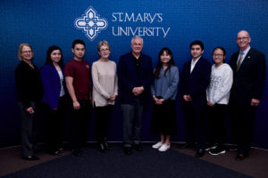 Carlos Alvarez joins students at a scholarship luncheon on March 5, 2019.
