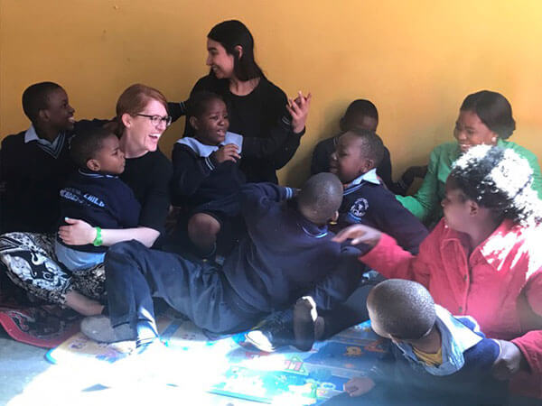 Pyschology professor Jillian Pierucci, Ph.D., with children in Zambia