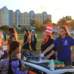 Students in costumes play games with area children at Boo Bash 2018.