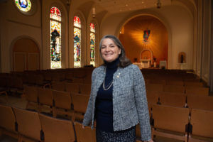 Alicia Tait stands inside Assumption Chapel.