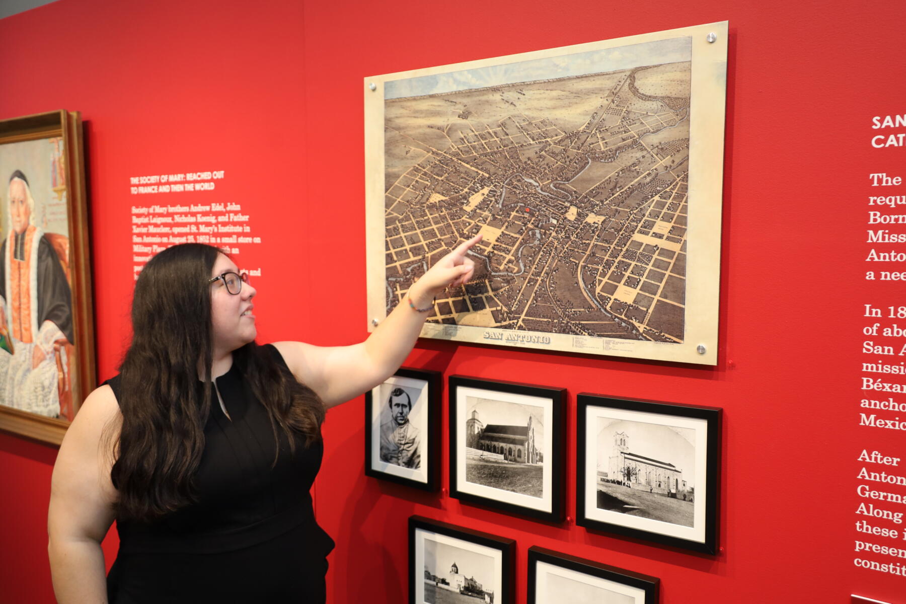 Student points to a historic photo of St. Mary's University.