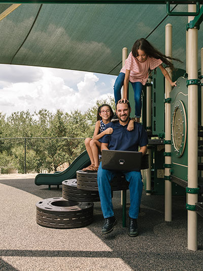 Cybersecurity graduate Mark Maldonado and his daughters