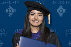 Sammantha Rodriguez takes a graduation photo.