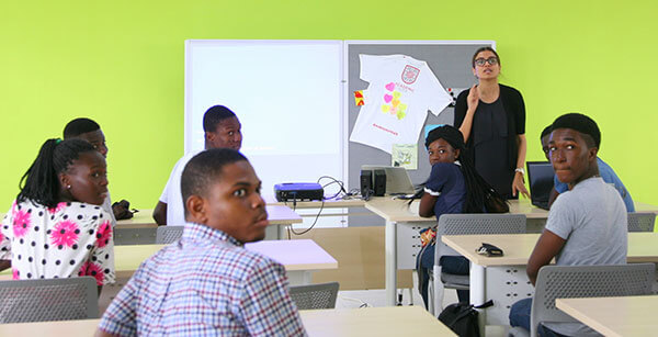 Alumna Sunitha Jenarius in a classroom