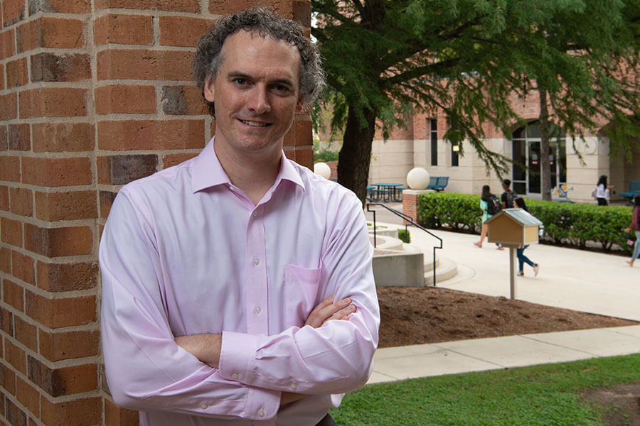 Todd Hanneken stands outside Blume Library.