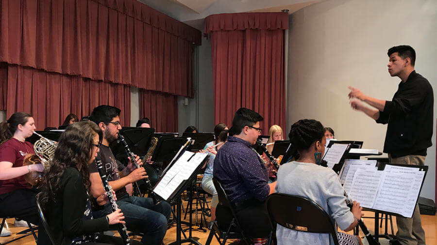 Student apprentice conductor conducting band
