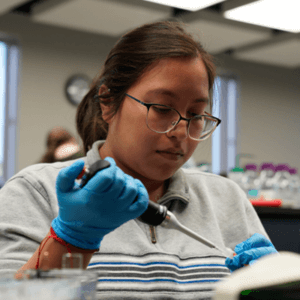Biology student using equipment.