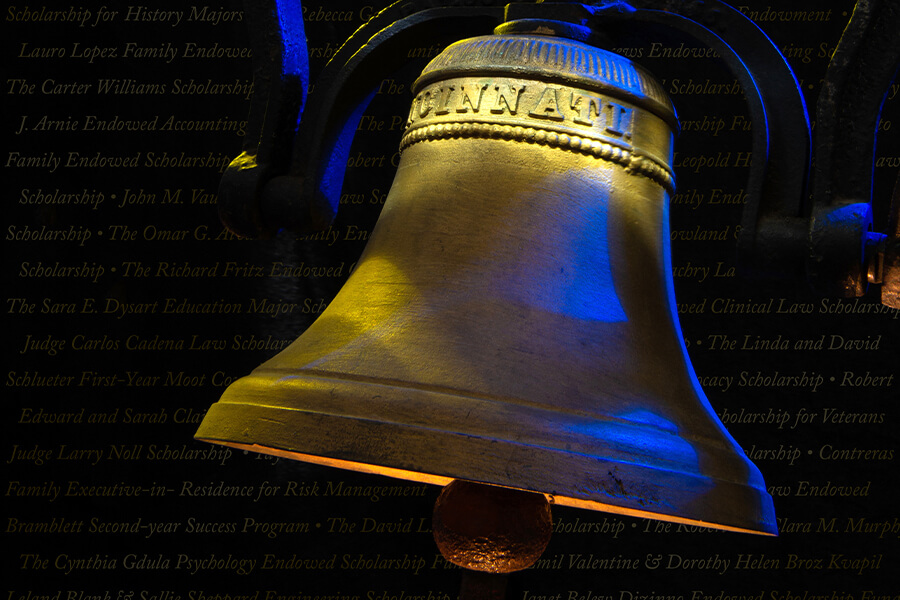 A historic St. Mary's bell is light in gold and blue.