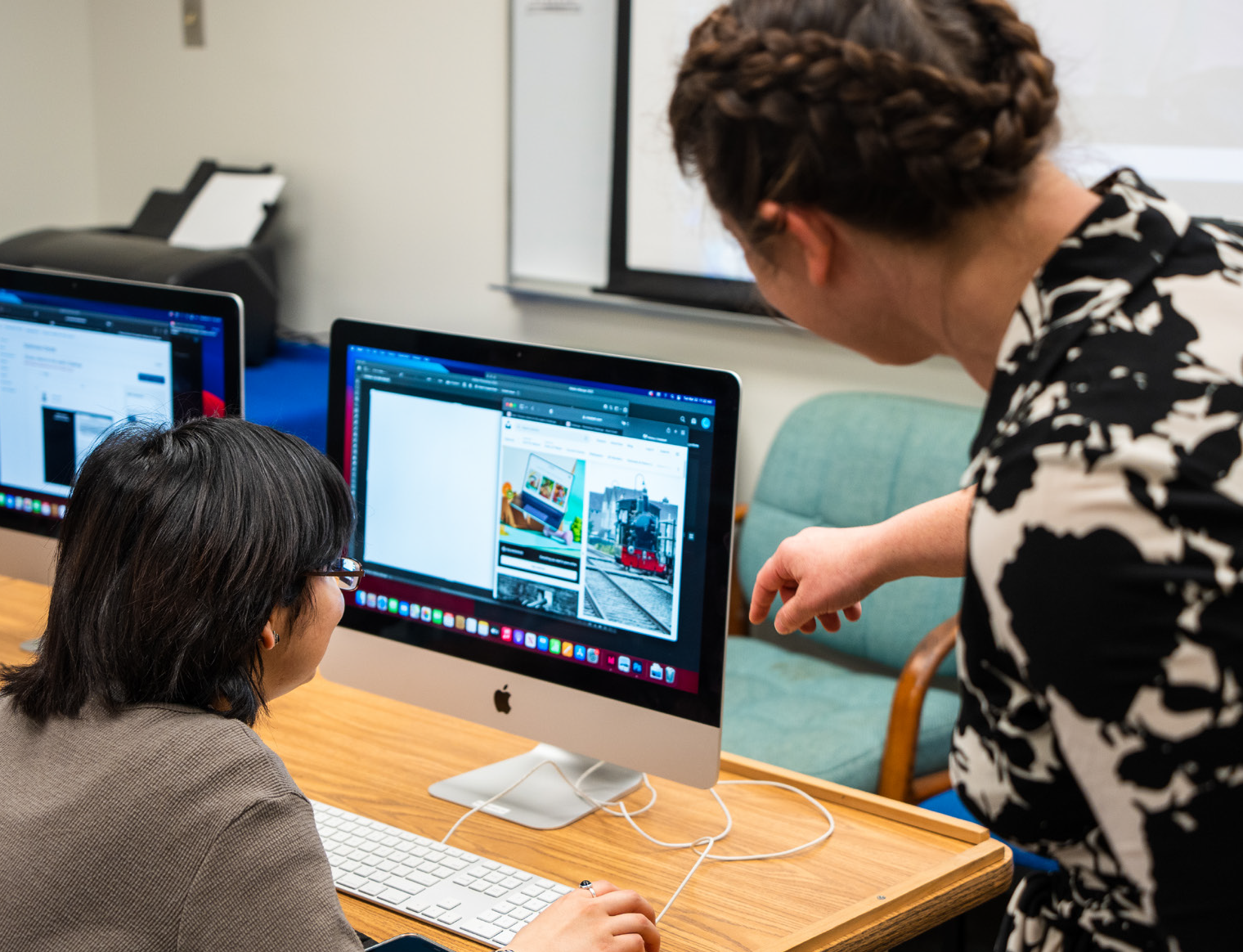 two females looking at a computer screen