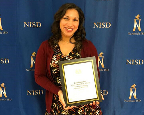 Alumna Celina receiving award for Northeast Independent School District