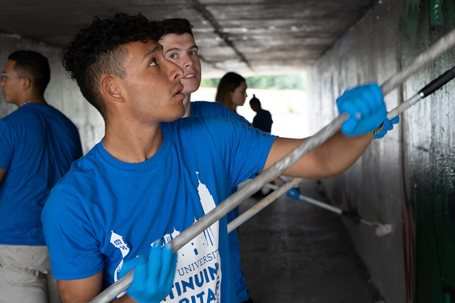 Students help with graffiti abatement during Fall 2019 Continuing the Heritage.