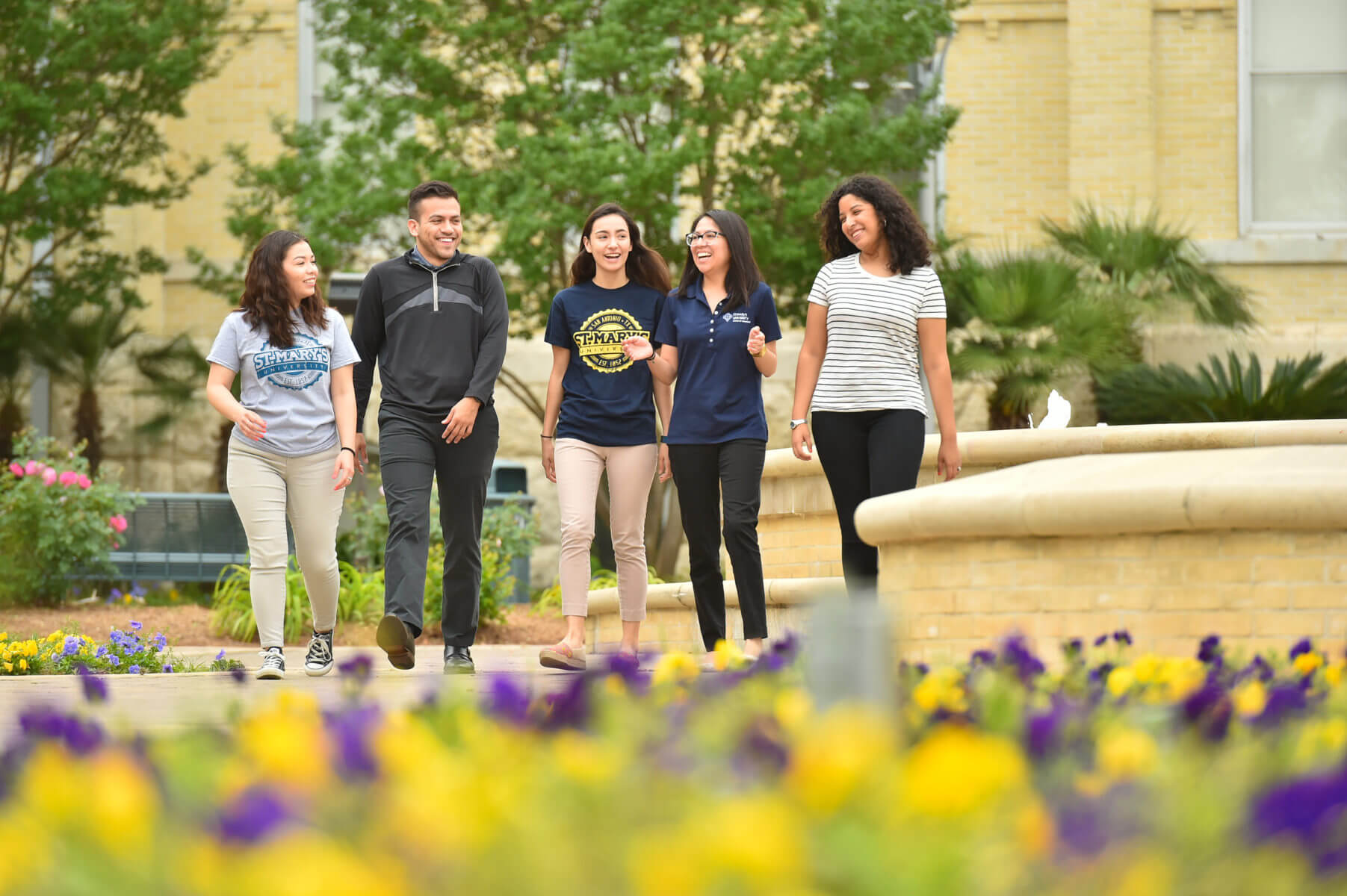 St. Mary's tour guide leads a group of excited prospective students on a campus tour.