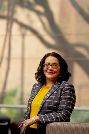 Cathy Casiano standing in front of the law library