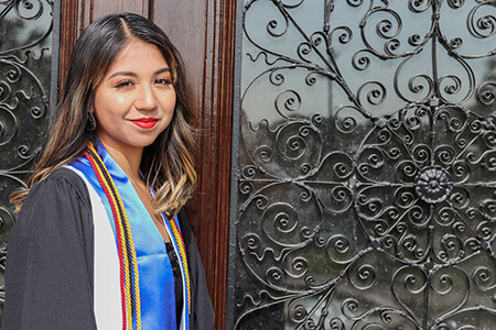 Graduate in front of doors