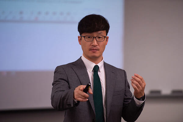 Daniel Kim, Ph.D., teaching in classroom