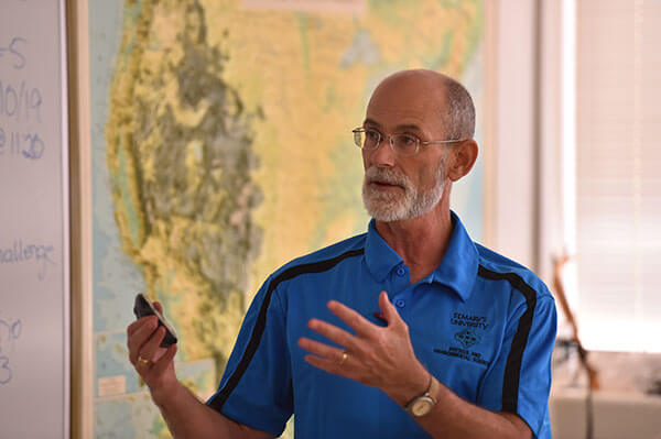 David Turner, Ph.D., teaching in a classroom. 