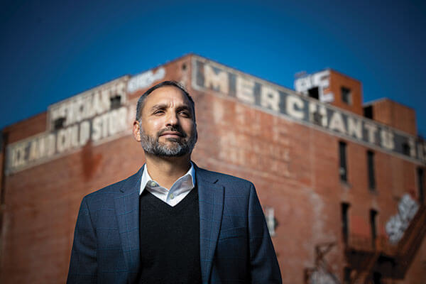 Rene Dominguez stands in front of the Merchants Ice and Cold Stage Building on East Houston Street