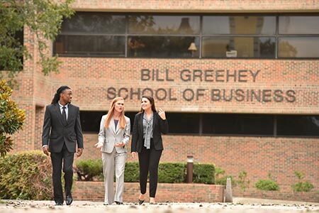 GSB students walking by building