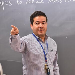 Juan Ocampo, Ph.D., instructing in class