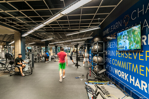 Students work out in the campus fitness center