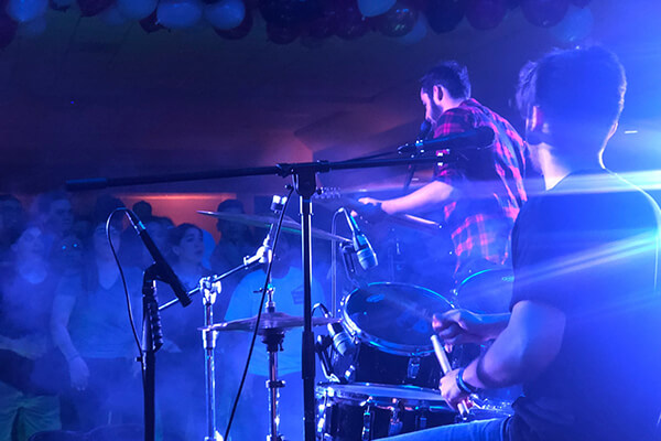 A student band is cheered on at Battle of the Bands