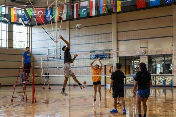 Students play in an intramural volleyball game